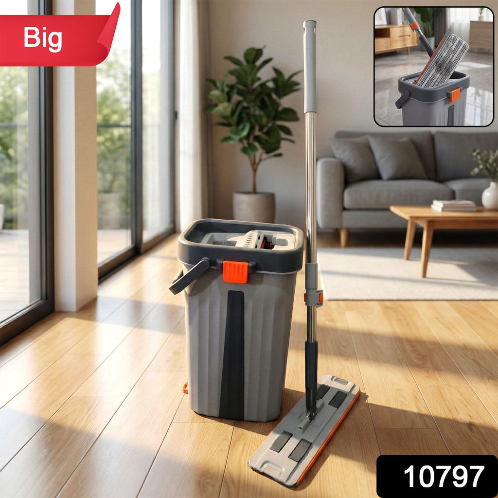 Flat mop with long handle alongside bucket with wringer mechanism for efficient floor cleaning