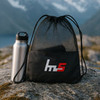 Detail of the cinch drawstring closure and shoulder straps on the gym bag.
