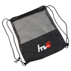 Person carrying a sleek mesh drawstring gym sack over the shoulder.