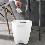 Stackable plastic dustbins, demonstrating their space-saving design.