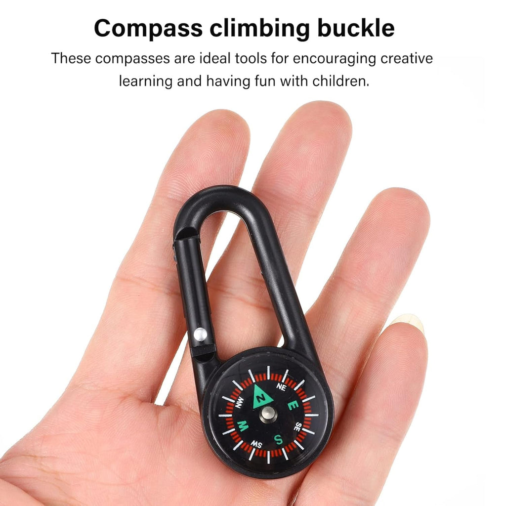 The mini compass with clip held near a map, illustrating its practical application for navigation.