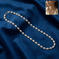 Elegant pearl beaded necklace with gold-tone link detailing