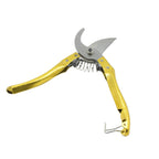 Ergonomic garden shears cleanly cutting a green stem, demonstrating their effective pruning action.