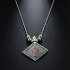 Ethnic oxidised silver finish pendant necklace displayed on white background