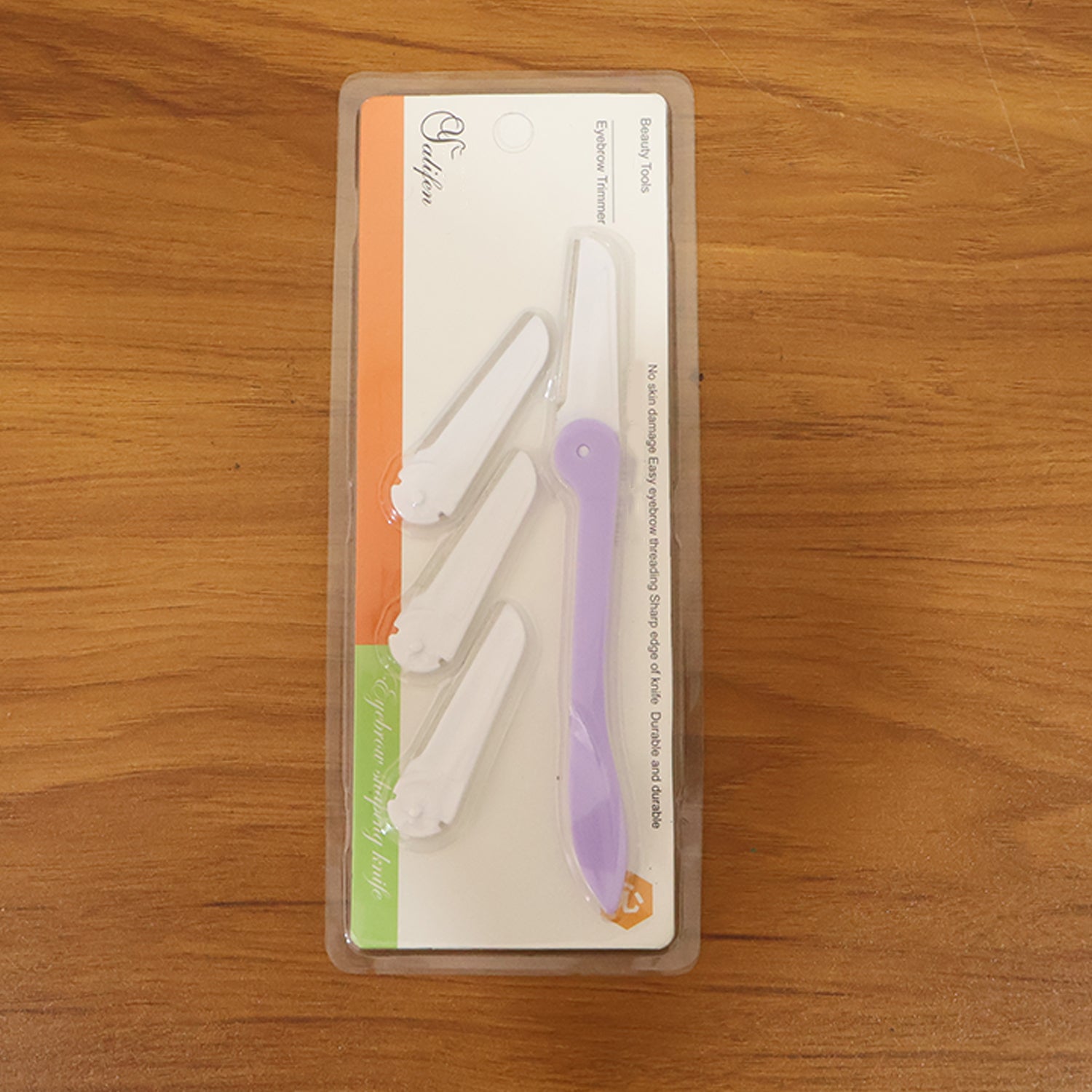 Compact facial grooming razor designed for precision eyebrow care