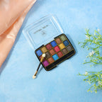 Close-up view of pink and purple shimmer eyeshadow shades in the palette