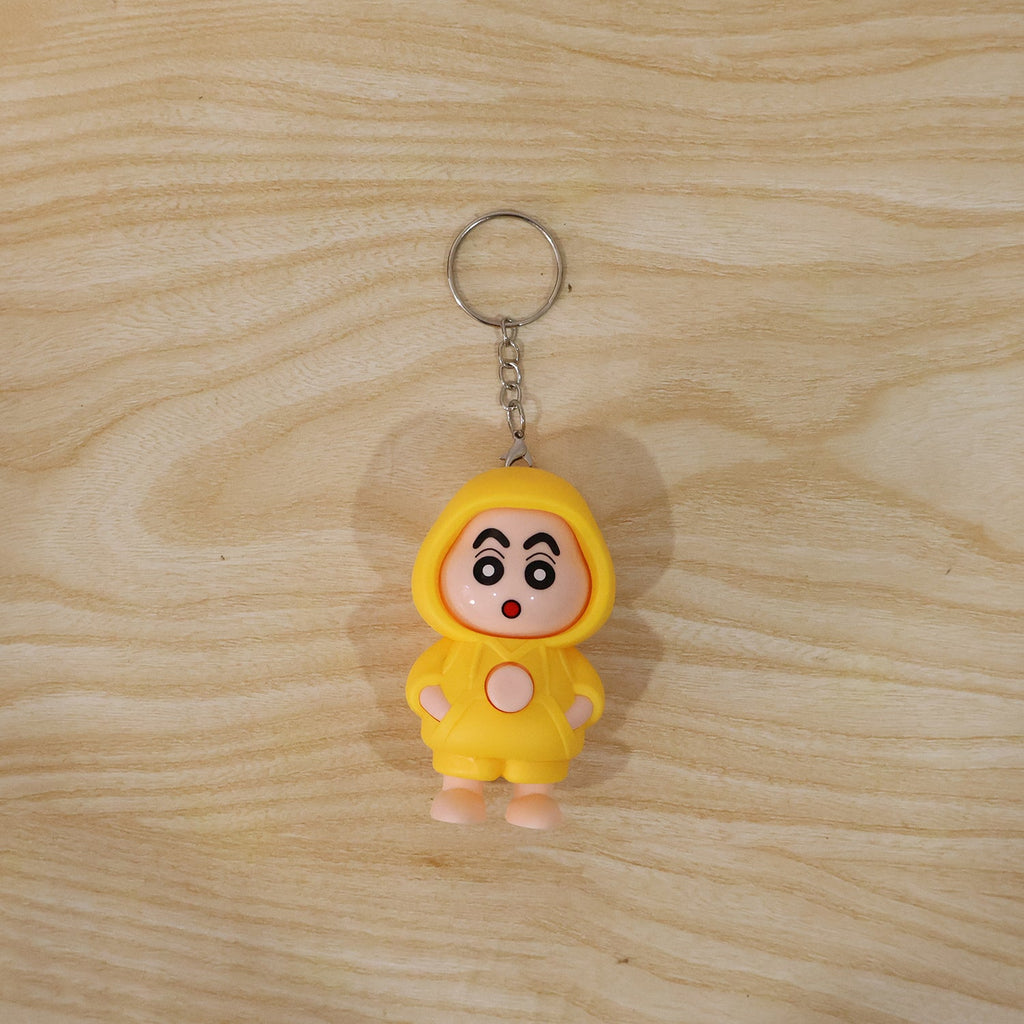 In-use image of face-changing doll keychain attached to backpack