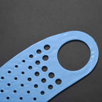 Person using face mask ear saver strap for reusable mask comfort