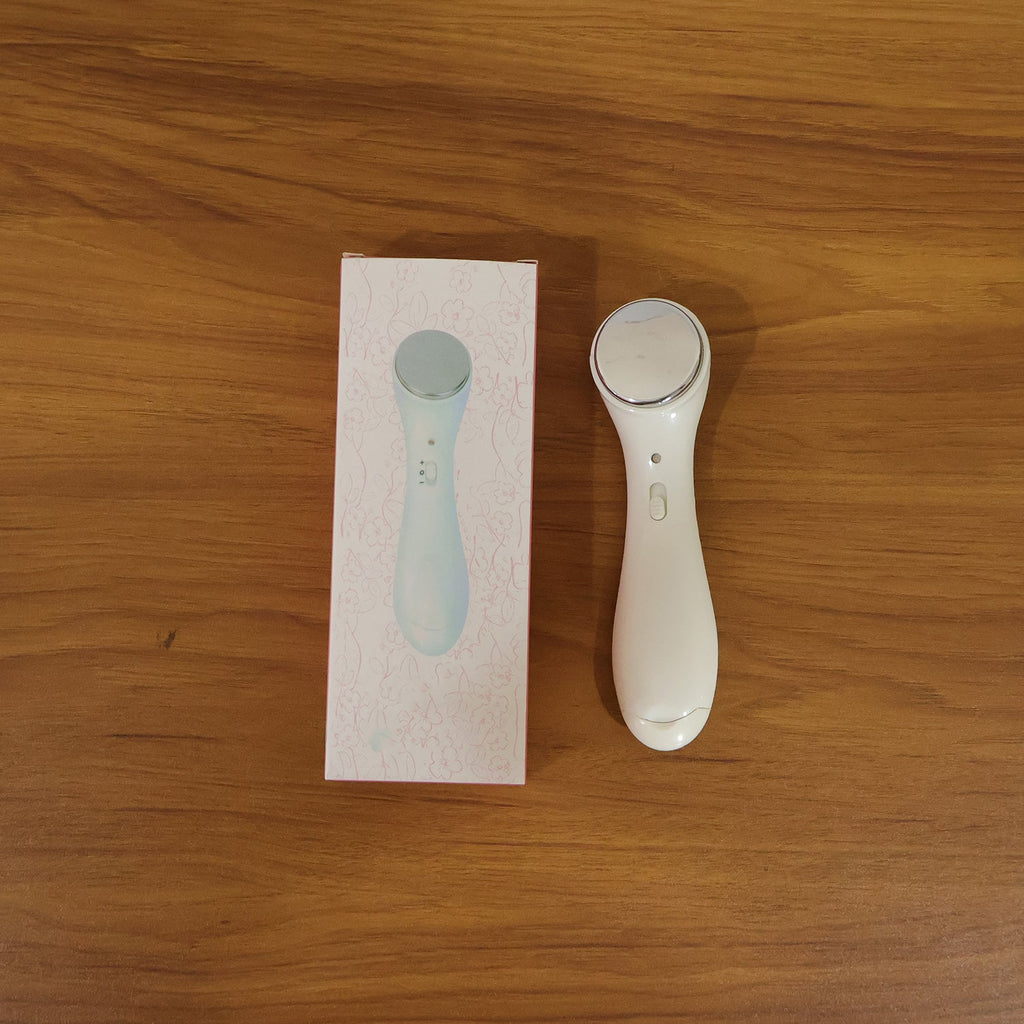Facial massager device in action on face