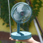 Side angle of foldable mini desk fan highlighting adjustable height