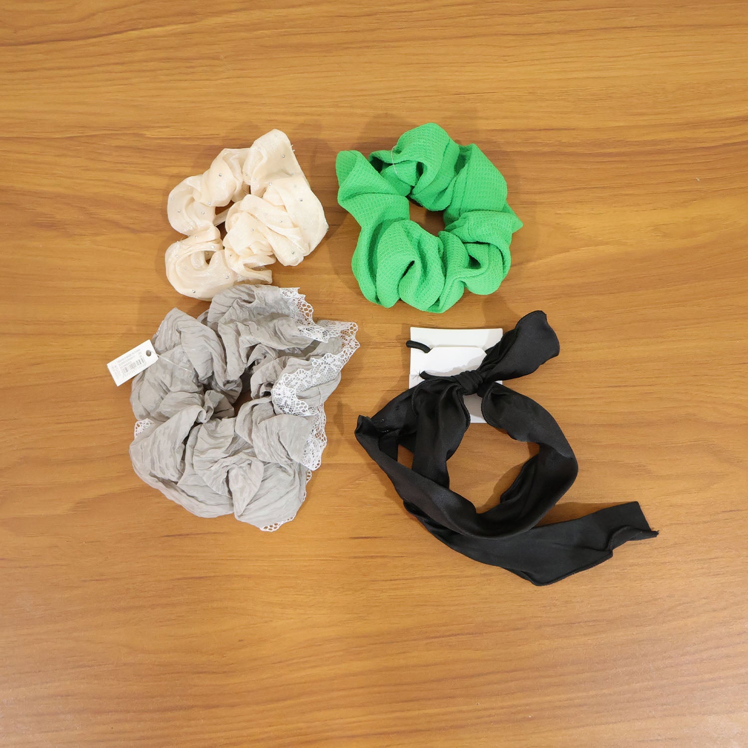 Fashionable hair scrunchie with fabric bow tie, ideal for daily hair styling