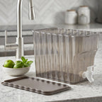 Product display of the clear plastic beverage dispenser on a kitchen counter