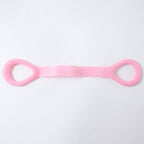 Woman using resistance band for arm exercises during workout