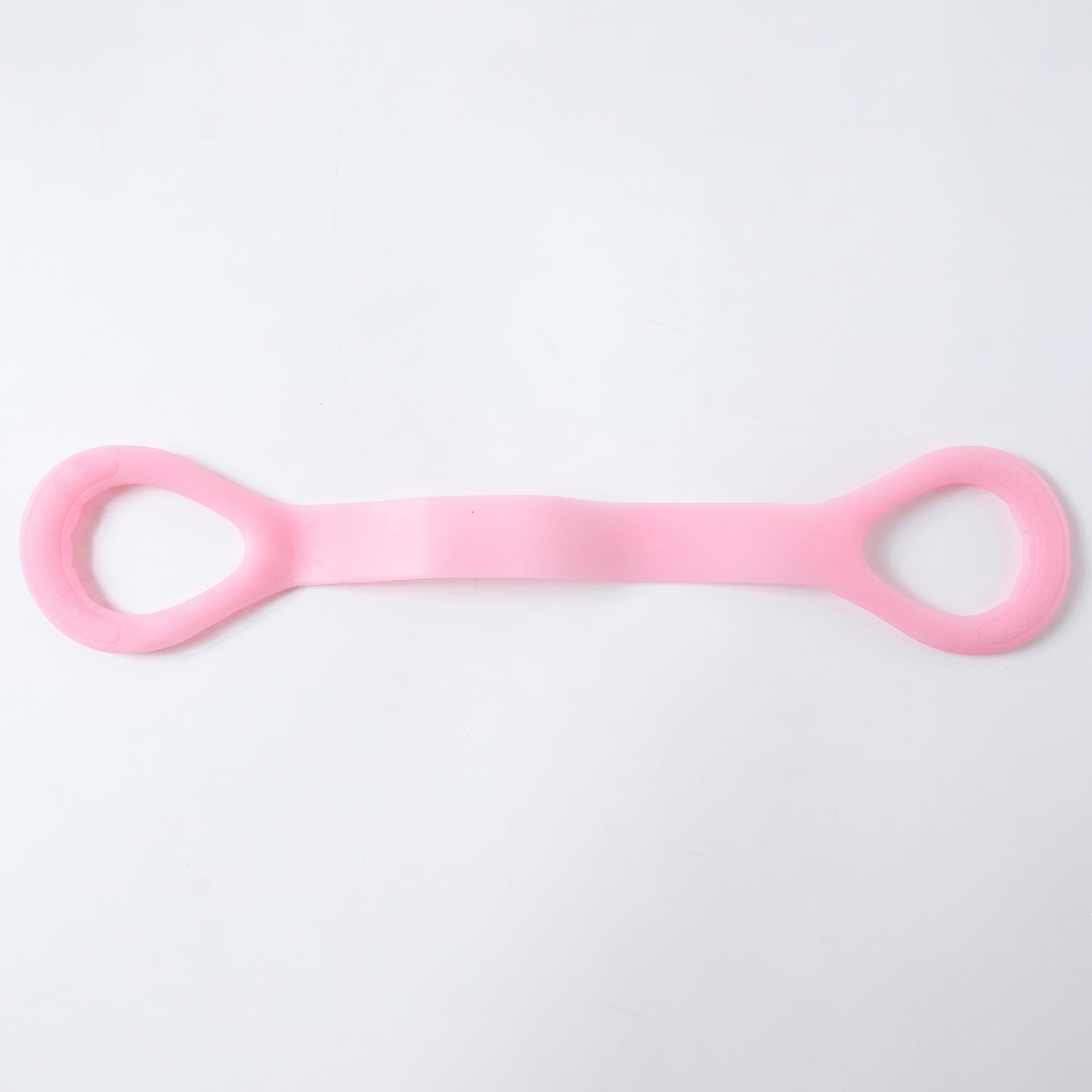 Woman using resistance band for arm exercises during workout