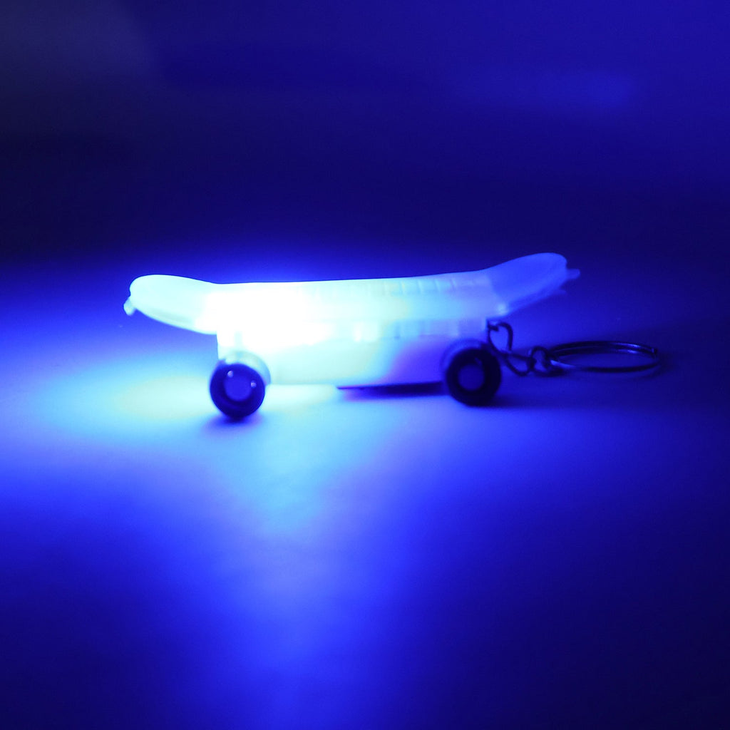 Mini skateboard keychain on white background