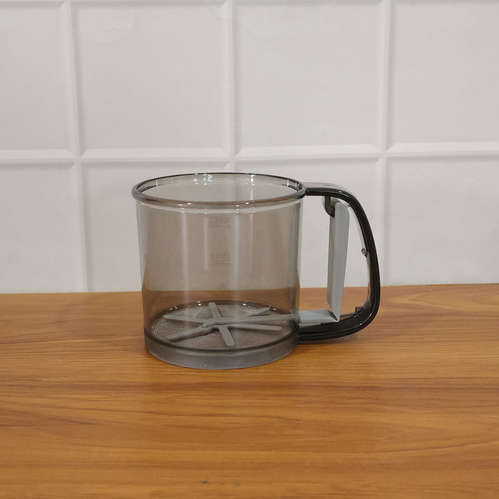 Kitchen baking gadget plastic flour sieve cup in use