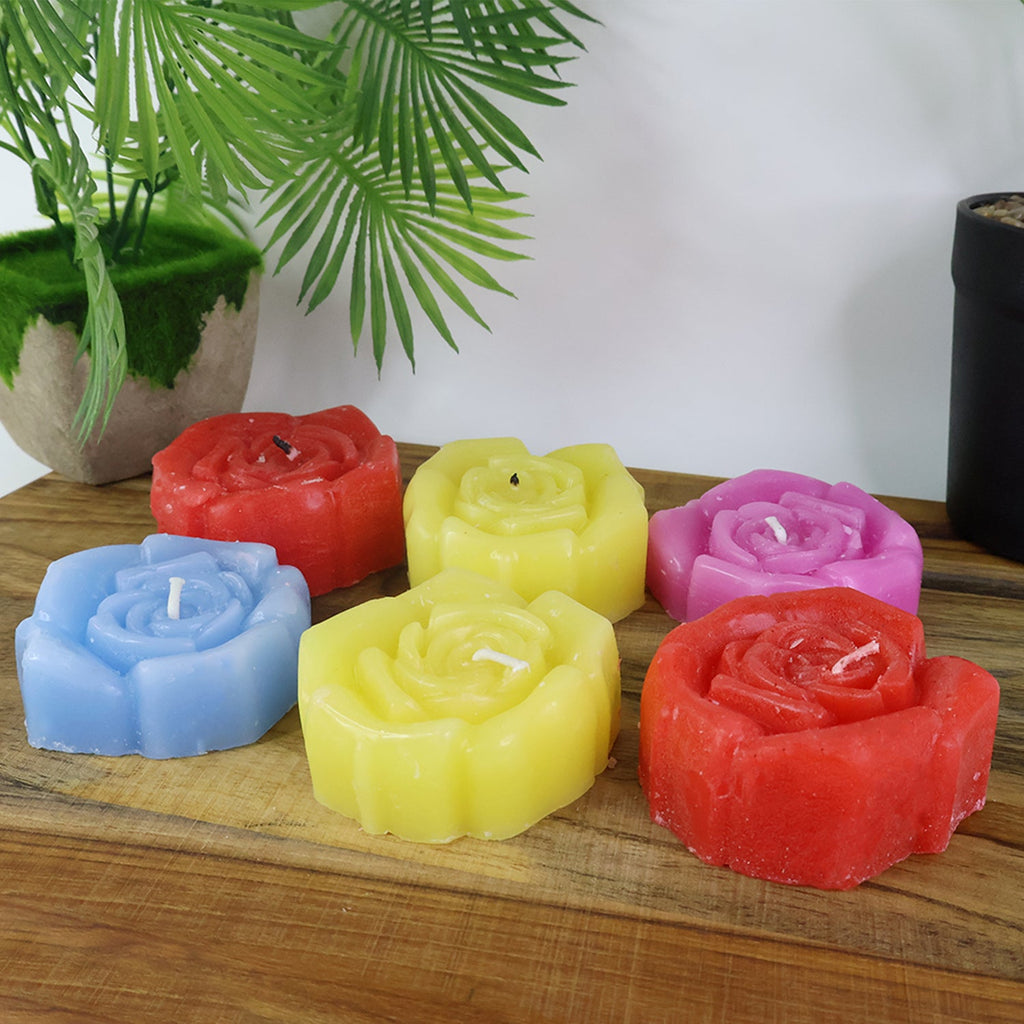 Soft glowing rose shaped wax candles creating a romantic and cozy environment