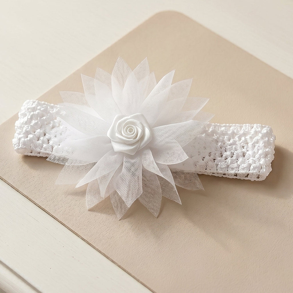 Close-up of floral bow on the soft stretchable baby headband