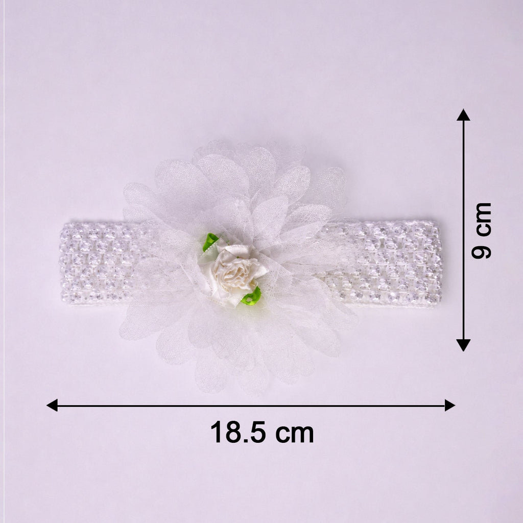 Close-up of colorful floral baby headband made from elastic fabric