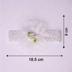 Close-up of colorful floral baby headband made from elastic fabric