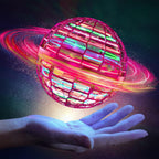 Comparison shot of the flying ball toy next to a hand to illustrate its scale.