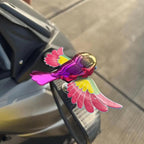Car interior featuring decorative flying bird dashboard ornament