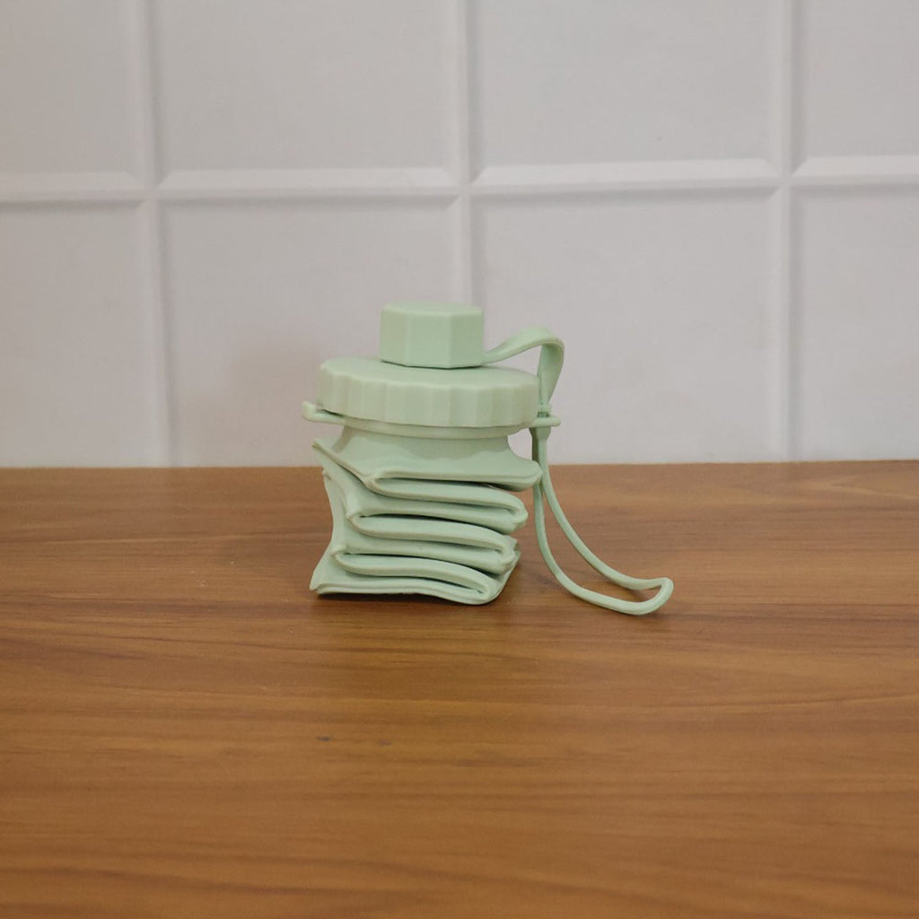 Demonstration of folding the collapsible silicone water bottle