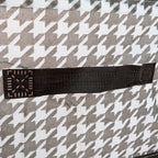 Detail shot of the canvas storage basket showing its reinforced steel support structure for durability.