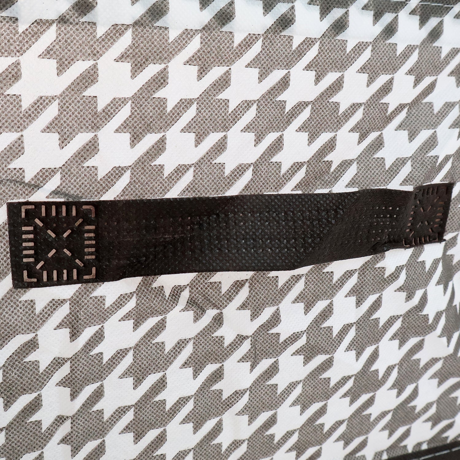 Detail shot of the canvas storage basket showing its reinforced steel support structure for durability.