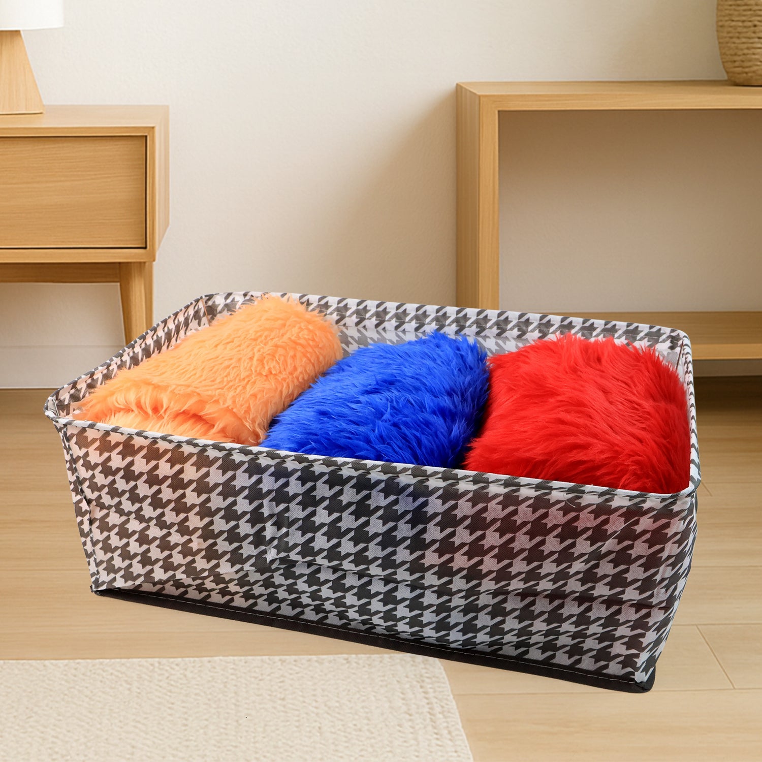 The canvas storage basket neatly folded flat, demonstrating its space-saving design for easy storage.