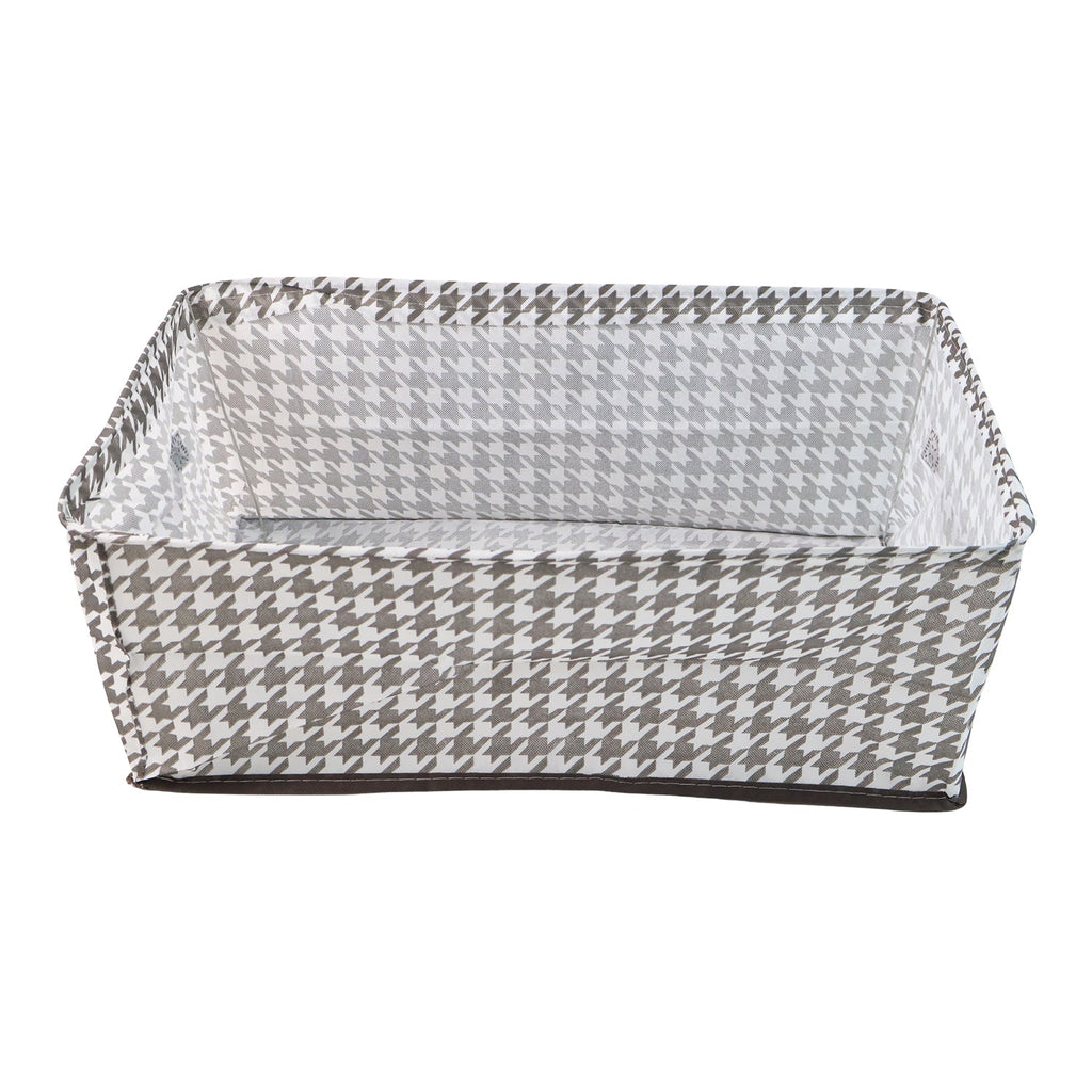 A minimalist-designed foldable canvas storage basket filled with soft linens, enhancing room aesthetics.