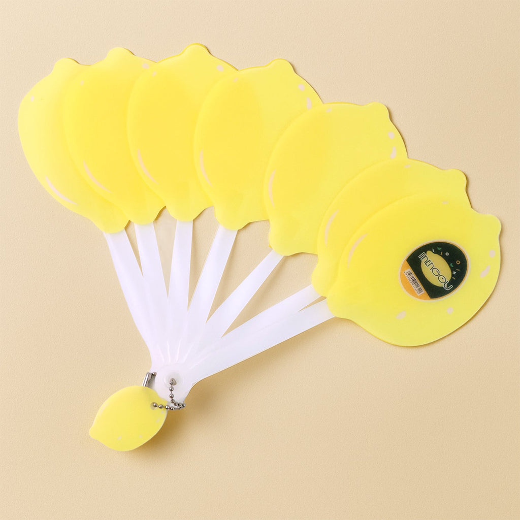 Foldable lemon-shaped hand fan closed in compact portable form