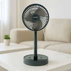 Portable USB folding fan with built-in phone holder in use