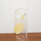 Lemon-shaped hand fan providing instant manual cooling and comfort