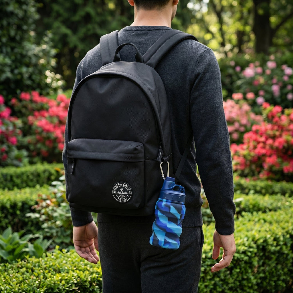 Wide mouth flip cap of collapsible water bottle open for easy filling