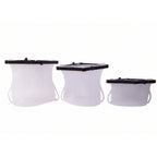 Variety of vibrant reusable silicone food bags filled with fruits and vegetables.