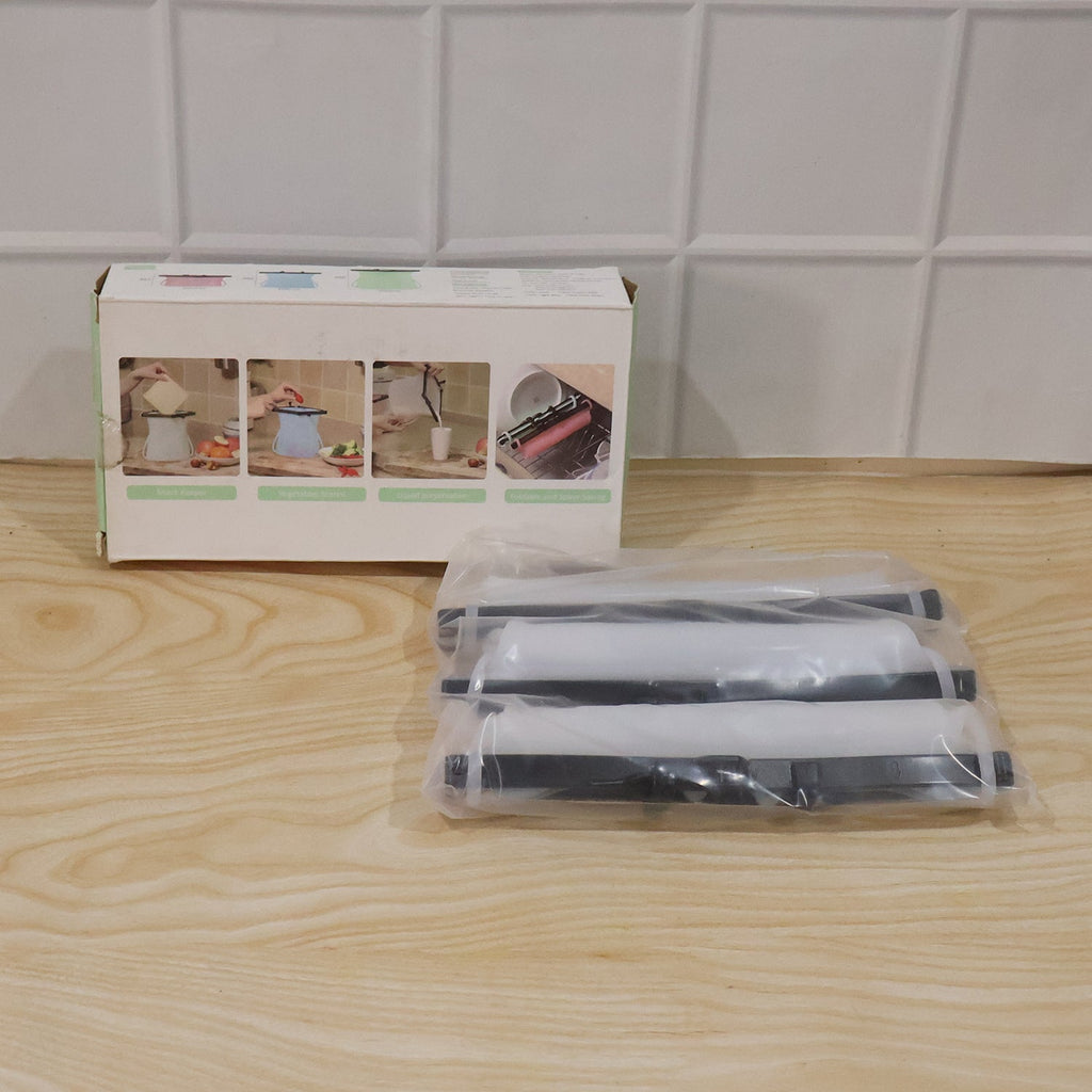 Silicone food saver bags with various contents like berries and snacks.