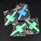 Multiple Food Pouch Sealer Clips in various colours on a kitchen counter.