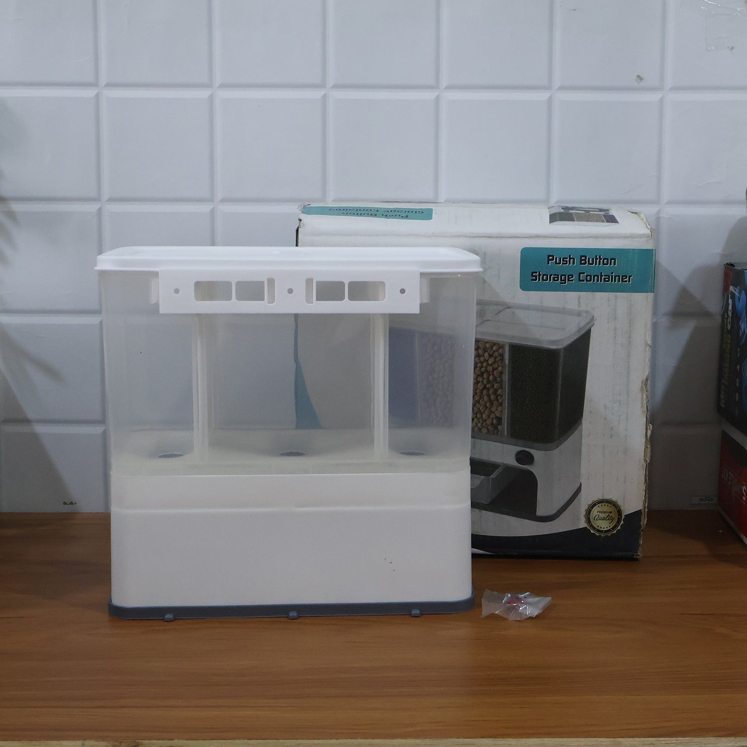 The 3-in-1 wall-mounted cereal dispenser in action, dispensing lentils.