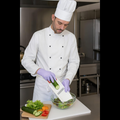 Close-up of the Multipurpose Slicer in action, demonstrating vegetable julienning.
