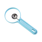 Detailed view of fruit cutter tool with ergonomic silicone handle