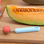 Close-up of fruit cutter with stainless steel scoop for precise cutting