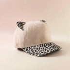 Cap with cat ears and printed visor, outdoor winter fashion