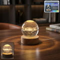 3D Astronomy Crystal Ball Lamp glowing softly on a wooden base.