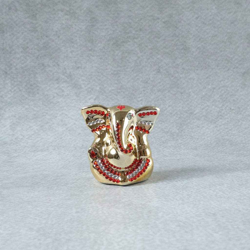 Religious decorative idol featuring golden finish for home and car
