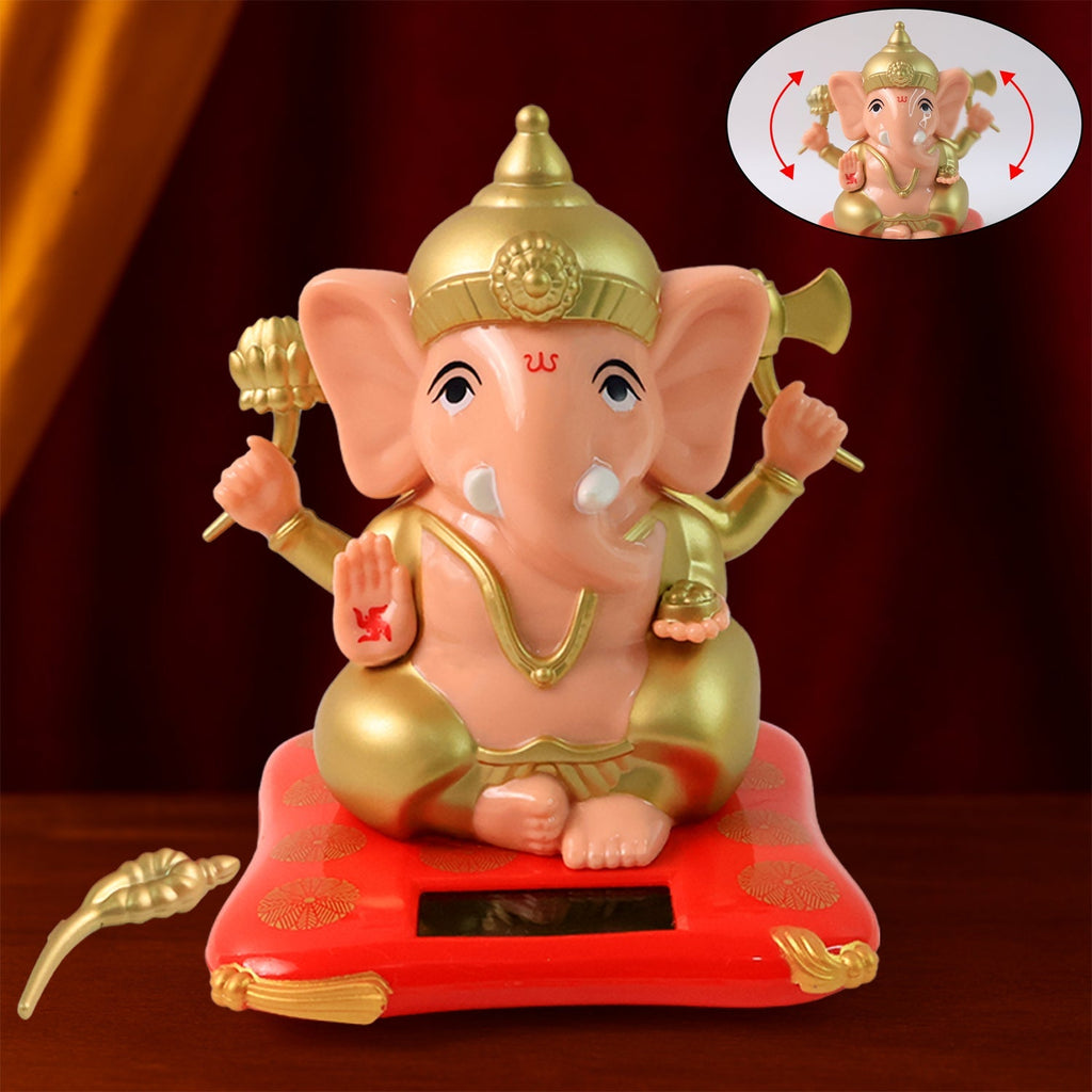 Solar-Powered Dancing Ganesha Idol with detailed gold accents on a decorative base