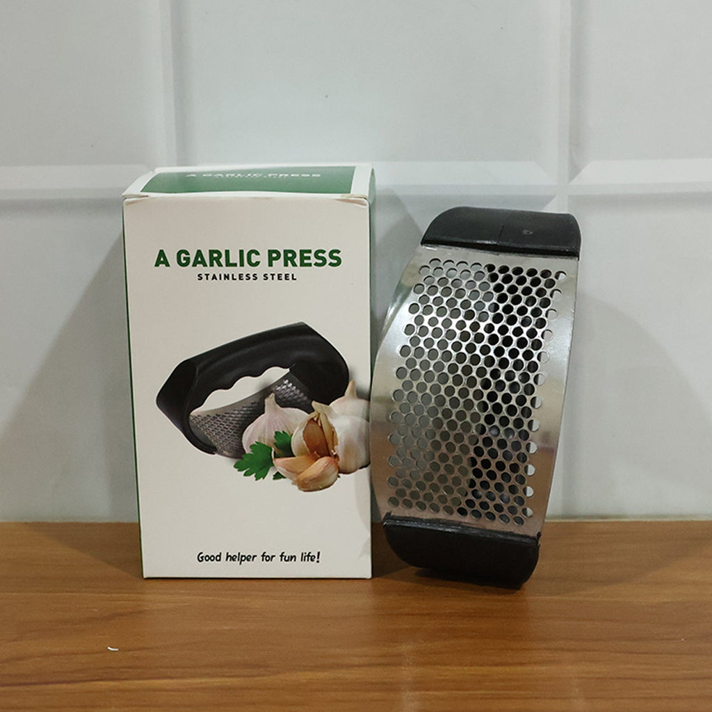Compact stainless steel garlic crusher for kitchen convenience