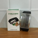 Compact stainless steel garlic crusher for kitchen convenience