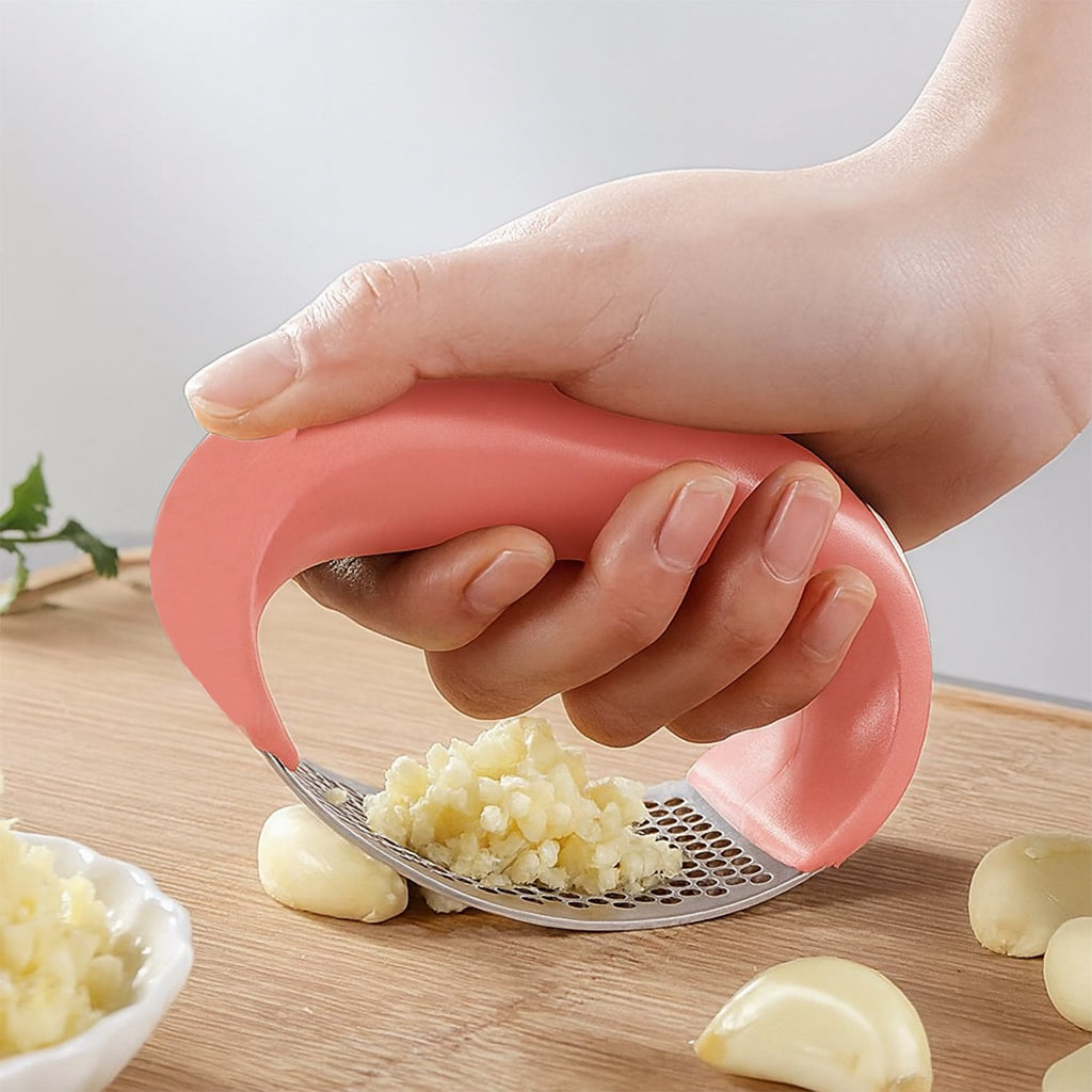 Detail of garlic press handle and stainless steel pressing surface