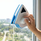 Double-sided magnetic glass cleaner on window